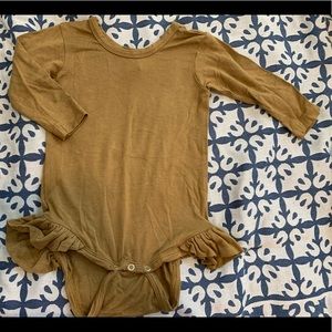 kate quinn ruffle leg bodysuit